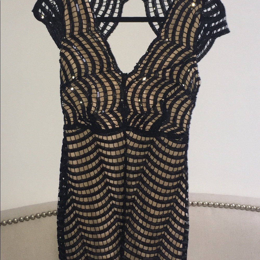 Black sequins w/beige inner lining dress.
